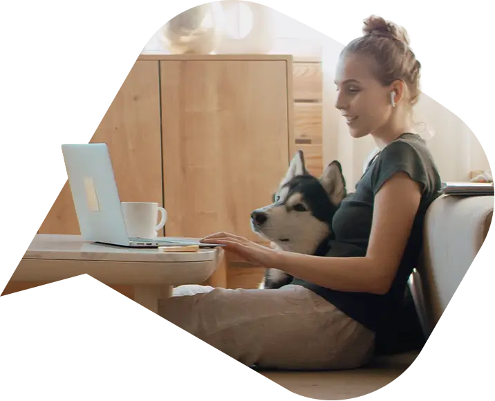 a woman and her dog working from home