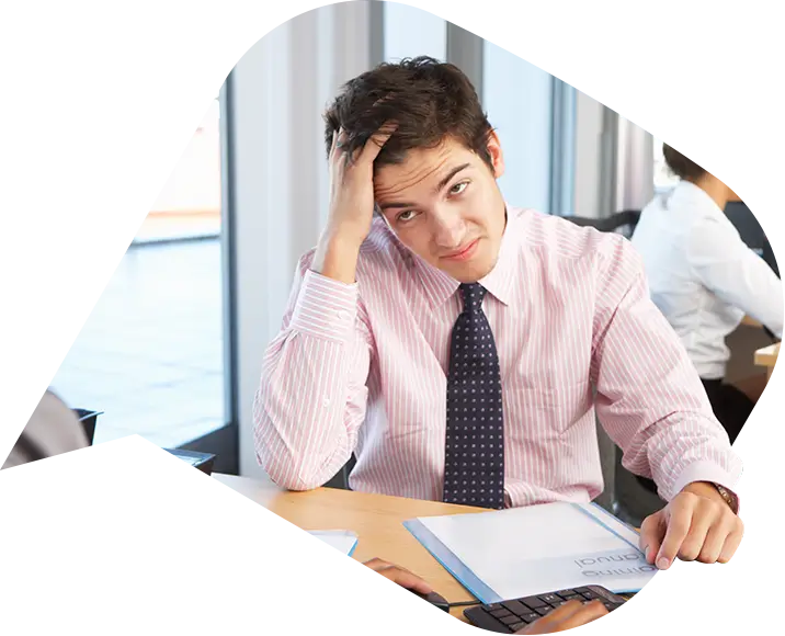 a man rubbing hid head after a grievance.