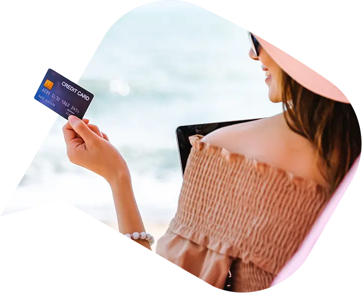 a woman paying for her holiday with a credit card