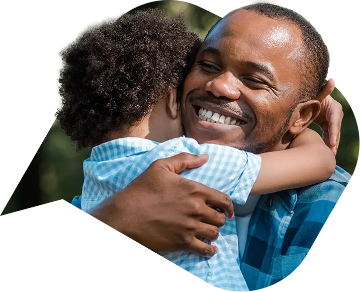 a man hugging his child