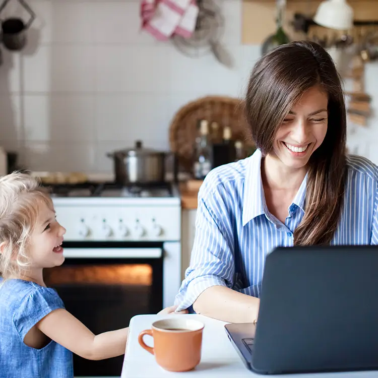 a mother and child working from home.