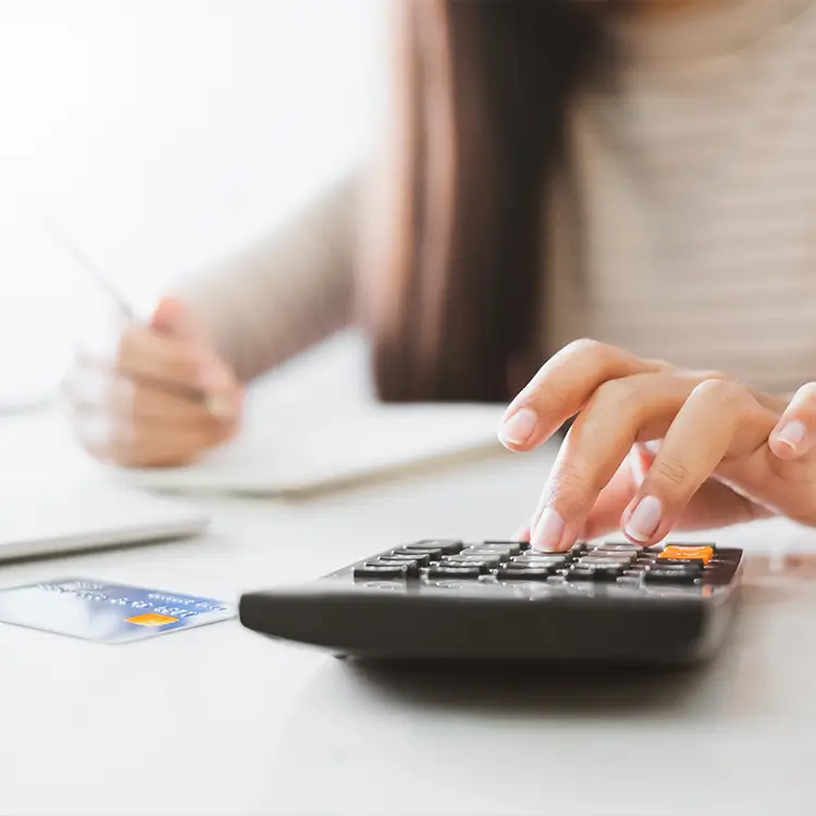 a lady using a calculator.